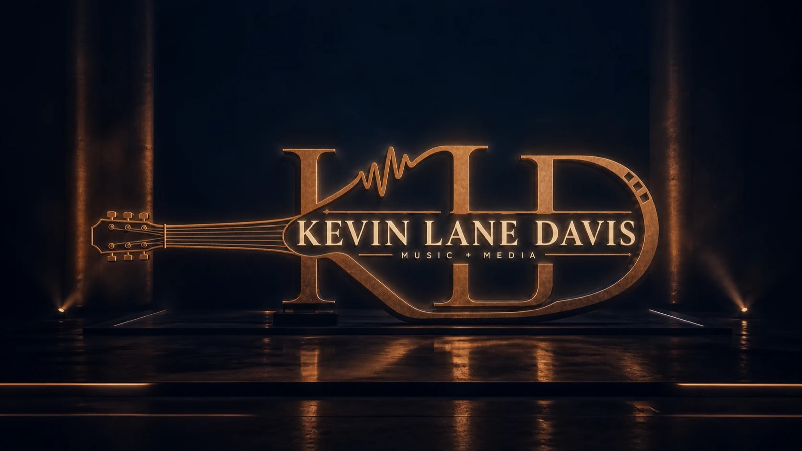 Kevin Lane Davis Music and Media bronze identity on a dark stage